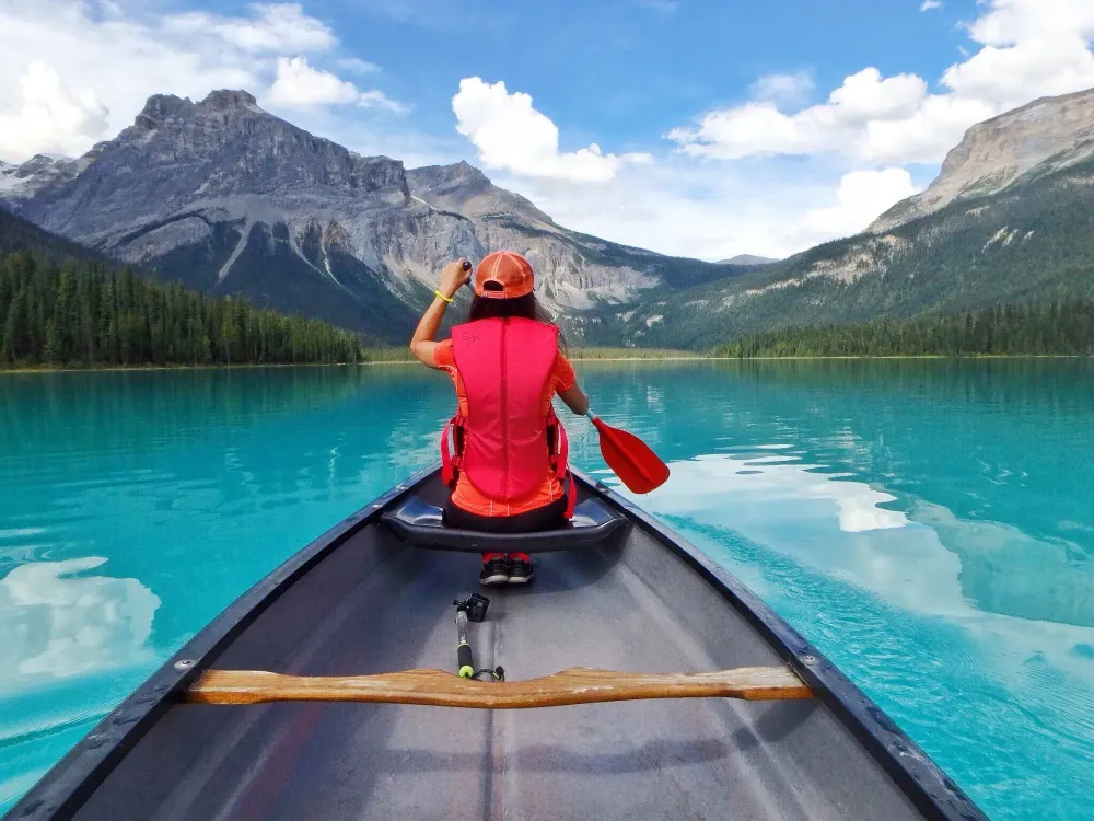 woman canoeing emerald lake canada